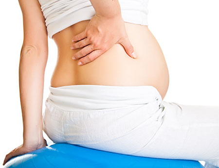 woman stretching for pregnancy rib pain